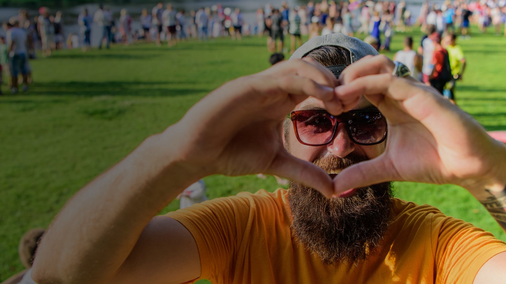 An enthusiastic volunteer lending his support at a sober social event